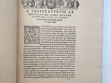 an open book with a drawing of a man on top of a building