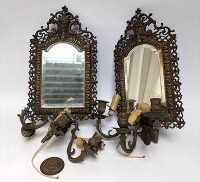 pair of antique brass wall sconces with mirrors and candle holders