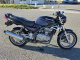 a motorcycle that is parked in the parking lot
