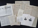 a lot of old newspapers on a black table