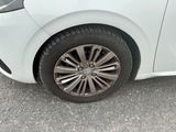 a close up of a car ' s tire on the pavement