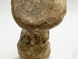 an image of a stone object on a white surface