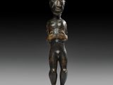 a bronze statue of a man with a helmet on his head