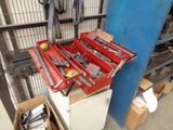 a red tool box sitting on top of a white refrigerator