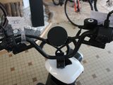 a close up of a motorcycle handlebar with a number of cards attached to it