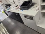 a white counter top with a printer on top of it