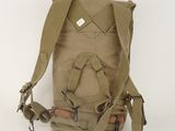 a backpack that is sitting on a white surface