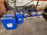 two blue plastic containers sitting next to each other on a pallet