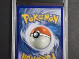 a close up of a card with a pokemon ball on it