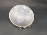 a close up of a glass object on a stand on a table
