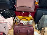 a lot of purses on a table in a store
