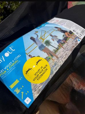 a bag with a sticker on it sitting on a person ' s lap