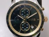 boss watch with black dial and gold accents on a black strap