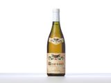 a bottle of white wine sitting on top of a table