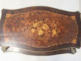a wooden table with a floral design on it