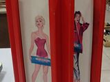 a picture of a paper model of a woman in a red dress
