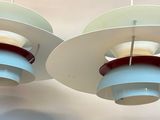 two lamps hanging from the ceiling in a room