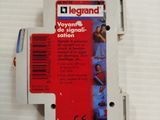 a white box with a red label on it that says legrand