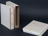 a stack of books sitting next to each other on a table
