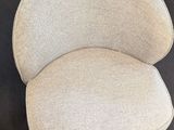 a close up of a chair that is on a table