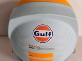 a close up of a helmet with a gulf logo on it