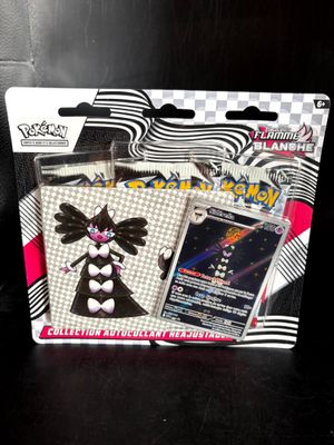 a box of pokemon trading cards on a table