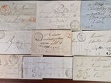 many old envelopes on the table with stamps on them