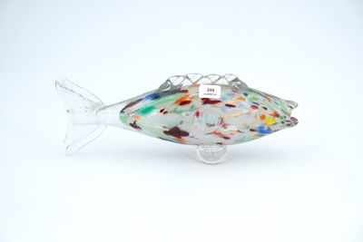 glass fish sculpture on a white surface with a white background