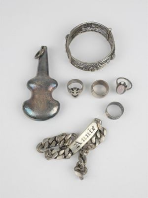 an assortment of silver jewelry including rings, bracelets, and rings