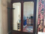 a large mirror in the corner of a room