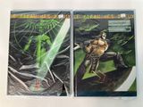 two comics are on a table with plastic wrap around them
