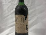 a bottle of wine that is sitting on a table