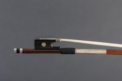 the bow is made of wood and has a white string
