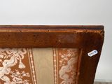 a close up of a wooden frame with a floral pattern on it