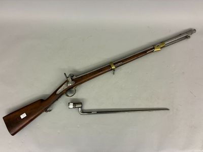 a rifle with a wooden handle and a metal handle on a white surface