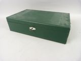 a green box with a lock on it on a white surface