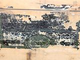 an old wooden box with peeling paint on it