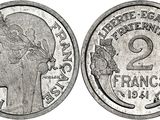 a close up of a coin with a woman ' s head on it