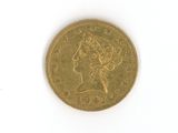 une pièce d'or avec l'image d'une femme dessus