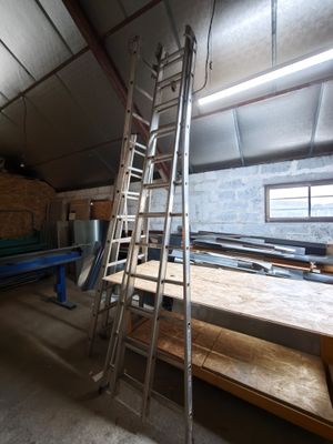 a ladder that is leaning against a wall in a room