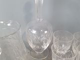 a lot of glasses and a vase on the table