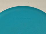 a blue frisbee sitting on top of a white table