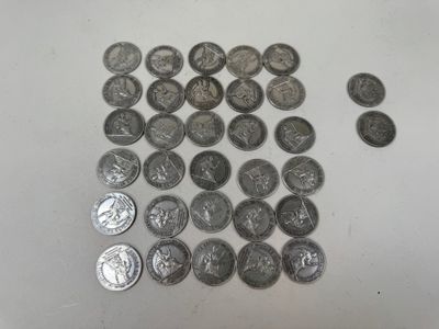 a lot of coins that are on the table