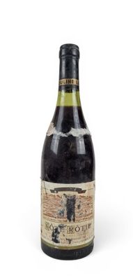 a bottle of wine that is sitting on a table