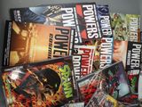 a lot of comic books sitting on a table