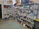 a room filled with lots of boxes and shelves