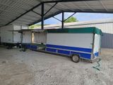 a trailer with a trailer attached to it in a building