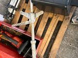 a red tool box with tools in it on the ground