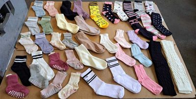 many pairs of socks laid out on a table