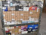 a metal cart with many boxes on it in a warehouse